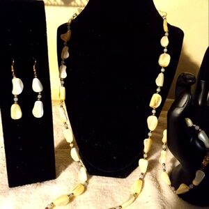Used,not new 3pc. 30in shell like necklace& matching bracelet& pierced earrings.